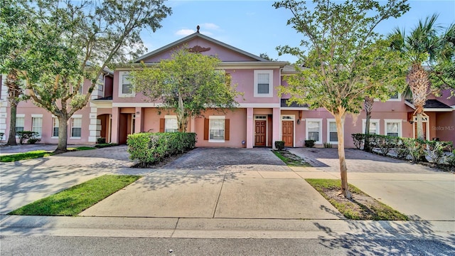 2343 Caravelle Cir, Kissimmee, FL 34746 - view of property featuring stucco siding and driveway