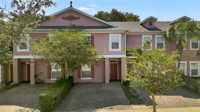 2343 Caravelle Cir, Kissimmee, FL 34746 - townhome / multi-family property with stucco siding and roof with shingles