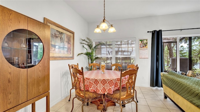 2343 Caravelle Cir, Kissimmee, FL 34746 - dining room with healthy amount of natural light, light tile patterned floors, and a chandelier