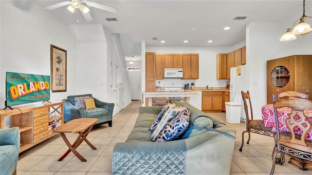 2343 Caravelle Cir, Kissimmee, FL 34746 - living area featuring light tile patterned floors, a ceiling fan, and recessed lighting