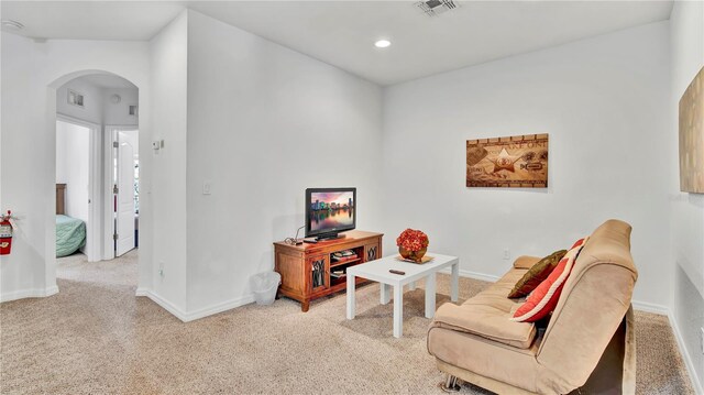 2343 Caravelle Cir, Kissimmee, FL 34746 - carpeted living area featuring arched walkways, baseboards, and recessed lighting
