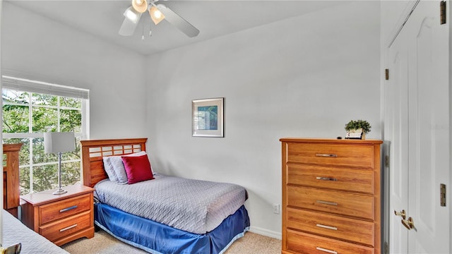 2343 Caravelle Cir, Kissimmee, FL 34746 - bedroom featuring light colored carpet, baseboards, and a ceiling fan