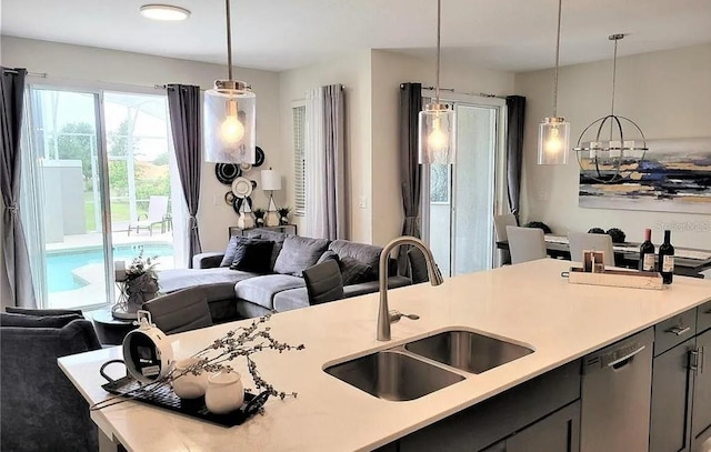 456 Ocean Course Ave, Davenport, FL 33896 - kitchen featuring a sink, open floor plan, stainless steel dishwasher, and light countertops