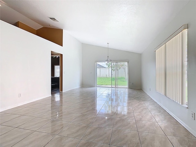 2314 Cormorant St, Kissimmee, FL 34743 - unfurnished room with high vaulted ceiling, light tile patterned floors, and a chandelier
