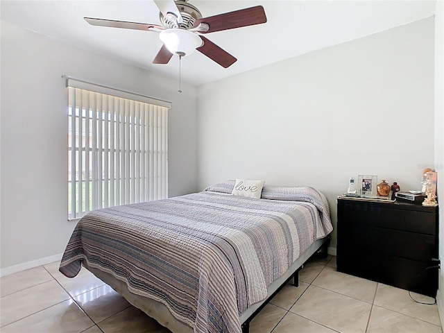 2314 Cormorant St, Kissimmee, FL 34743 - bedroom with baseboards, light tile patterned flooring, and ceiling fan