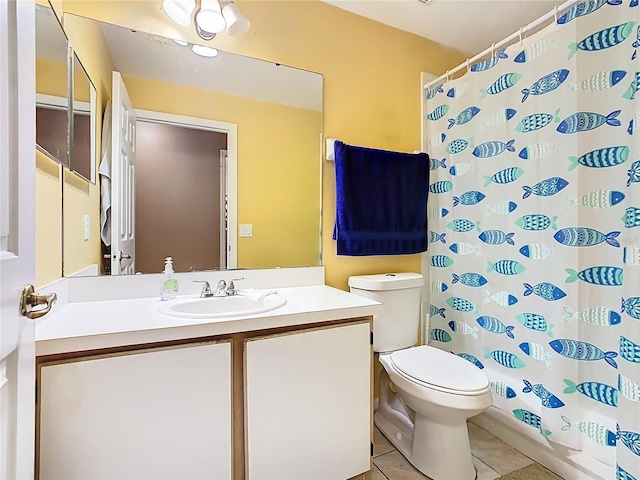 2314 Cormorant St, Kissimmee, FL 34743 - full bathroom featuring toilet, vanity, curtained shower, and tile patterned floors