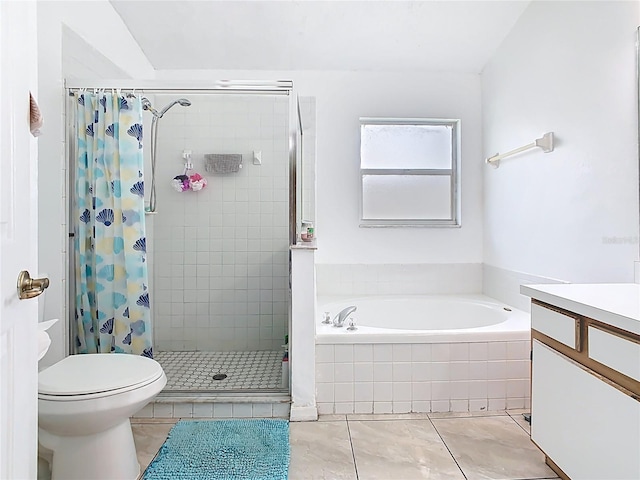 2314 Cormorant St, Kissimmee, FL 34743 - full bathroom with a shower stall, a bath, tile patterned flooring, toilet, and vanity