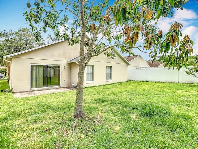 2314 Cormorant St, Kissimmee, FL 34743 - rear view of house featuring stucco siding