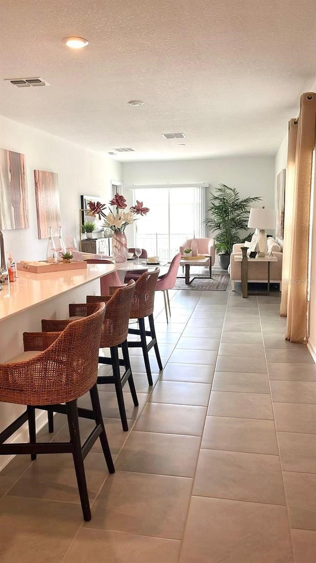 2002 Punch Bowl Ave, Davenport, FL 33837 - dining room featuring light tile patterned floors, recessed lighting, and a textured ceiling