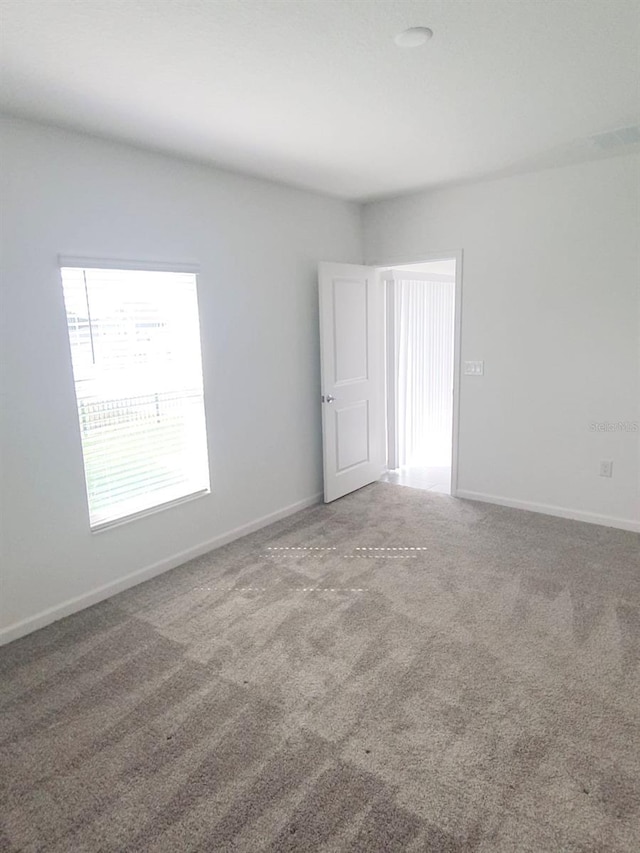 2002 Punch Bowl Ave, Davenport, FL 33837 - spare room with carpet and baseboards