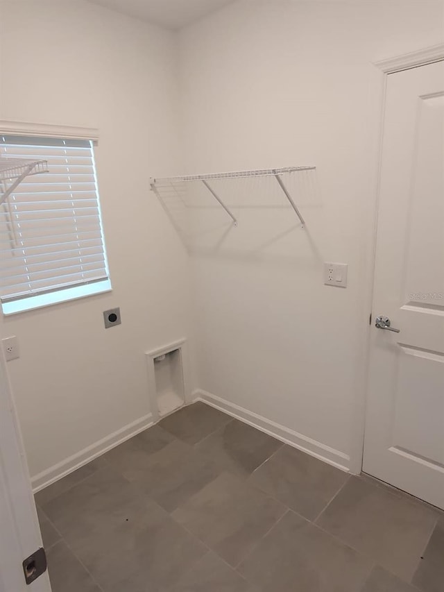 2002 Punch Bowl Ave, Davenport, FL 33837 - washroom featuring electric dryer hookup and baseboards
