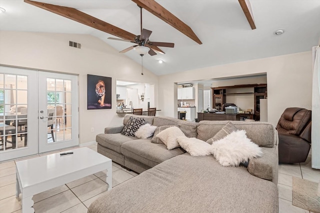 7011 Archwood Dr, Orlando, FL 32819 - living area with light tile patterned floors, ceiling fan, and french doors