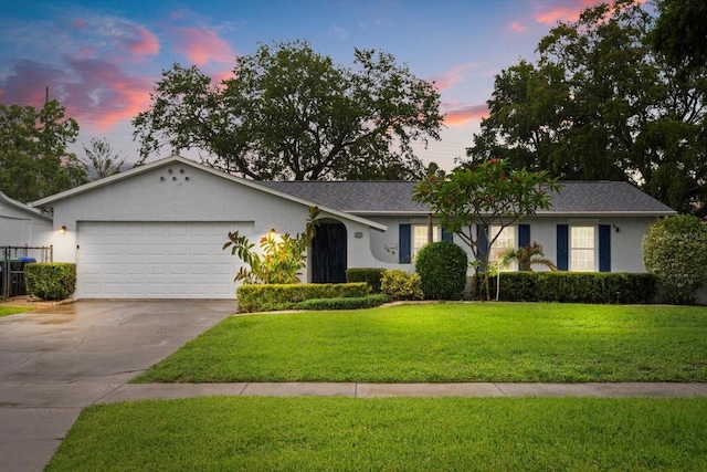 7011 Archwood Dr, Orlando, FL 32819 - ranch-style house with a garage, driveway, a yard, and stucco siding