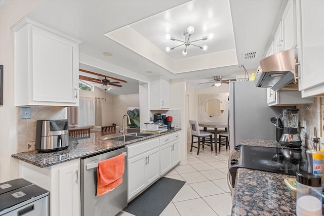7011 Archwood Dr, Orlando, FL 32819 - kitchen featuring appliances with stainless steel finishes, a ceiling fan, a sink, and island exhaust hood