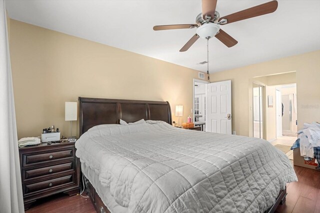 7011 Archwood Dr, Orlando, FL 32819 - bedroom with dark wood-style flooring and a ceiling fan