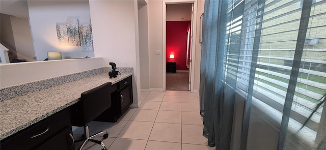1544 Nassau Point Trl, Kissimmee, FL 34747 - bathroom with healthy amount of natural light, tile patterned flooring, and baseboards