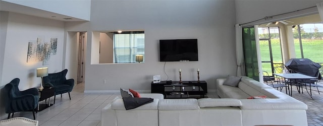 1544 Nassau Point Trl, Kissimmee, FL 34747 - living area featuring a high ceiling and light tile patterned floors