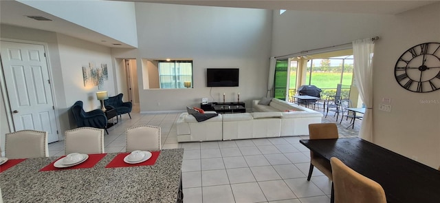 1544 Nassau Point Trl, Kissimmee, FL 34747 - living area with light tile patterned floors and a towering ceiling