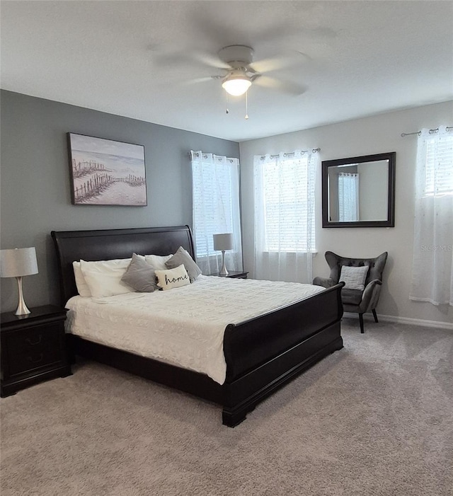 1544 Nassau Point Trl, Kissimmee, FL 34747 - carpeted bedroom featuring multiple windows, baseboards, and ceiling fan