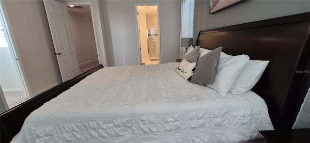 1544 Nassau Point Trl, Kissimmee, FL 34747 - bedroom with baseboards and ensuite bathroom