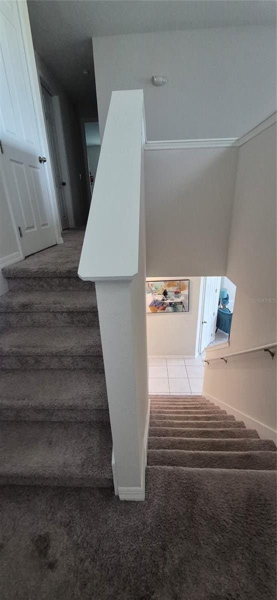 1544 Nassau Point Trl, Kissimmee, FL 34747 - staircase with carpet floors and baseboards