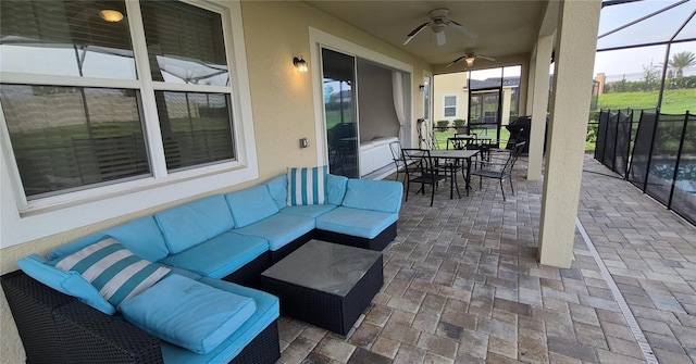 1544 Nassau Point Trl, Kissimmee, FL 34747 - view of patio featuring an outdoor hangout area, a ceiling fan, outdoor dining space, and glass enclosure