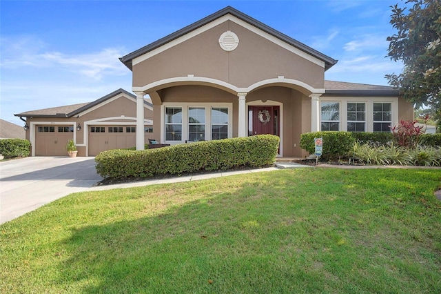 3551 Statham Dr, Apopka, FL 32712 - ranch-style home featuring stucco siding, a front yard, a garage, and concrete driveway