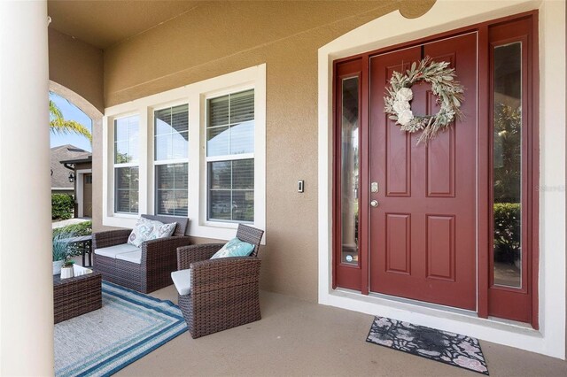 3551 Statham Dr, Apopka, FL 32712 - entrance to property with stucco siding and a porch