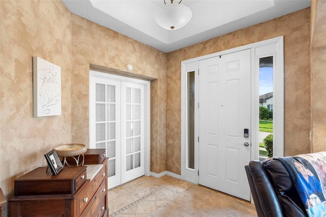 3551 Statham Dr, Apopka, FL 32712 - entrance foyer with light tile patterned floors, french doors, and baseboards
