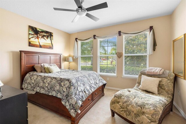 3551 Statham Dr, Apopka, FL 32712 - bedroom featuring light carpet, baseboards, and a ceiling fan