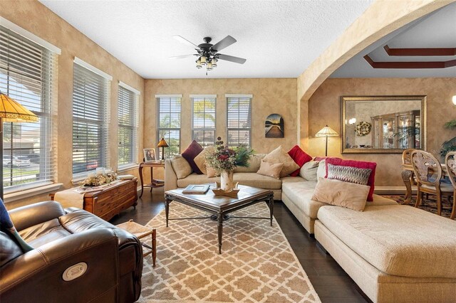 3551 Statham Dr, Apopka, FL 32712 - living area featuring wood finished floors, ceiling fan, plenty of natural light, and a textured ceiling