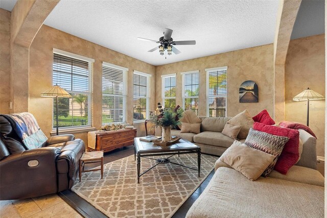 3551 Statham Dr, Apopka, FL 32712 - living room with ceiling fan, a textured ceiling, and tile patterned flooring