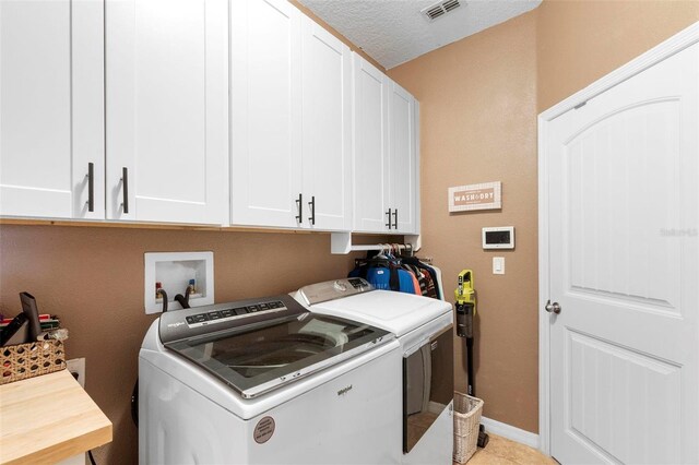 3551 Statham Dr, Apopka, FL 32712 - washroom featuring washing machine and dryer, cabinet space, and baseboards