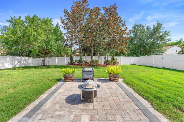 3551 Statham Dr, Apopka, FL 32712 - view of patio / terrace featuring an outdoor fire pit