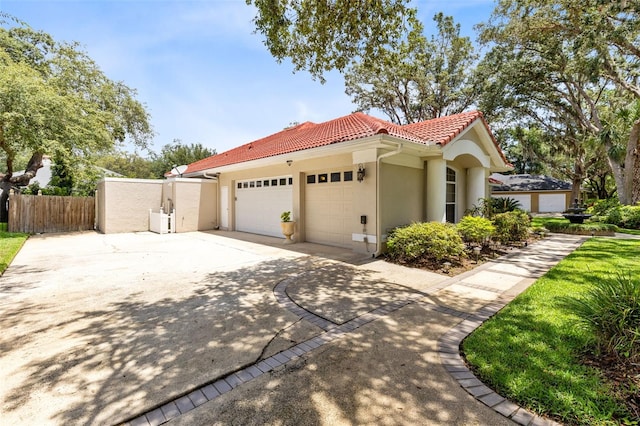 718 Glen Eagle Dr, Winter Springs, FL 32708 - view of side of property with a tiled roof, driveway, a garage, and stucco siding