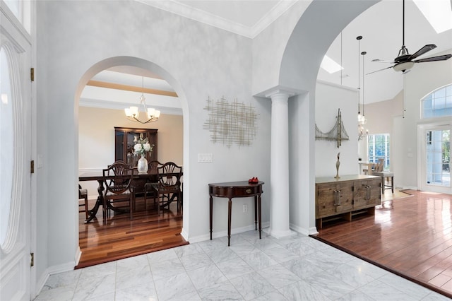 718 Glen Eagle Dr, Winter Springs, FL 32708 - entryway featuring ceiling fan, marble finish flooring, a high ceiling, a chandelier, and baseboards