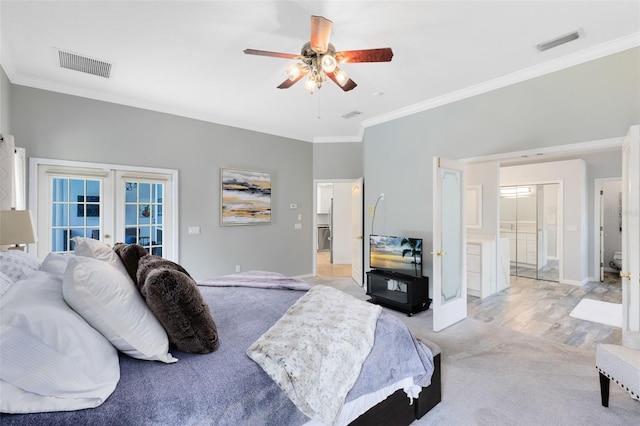 718 Glen Eagle Dr, Winter Springs, FL 32708 - bedroom featuring crown molding, french doors, baseboards, ensuite bath, and light colored carpet