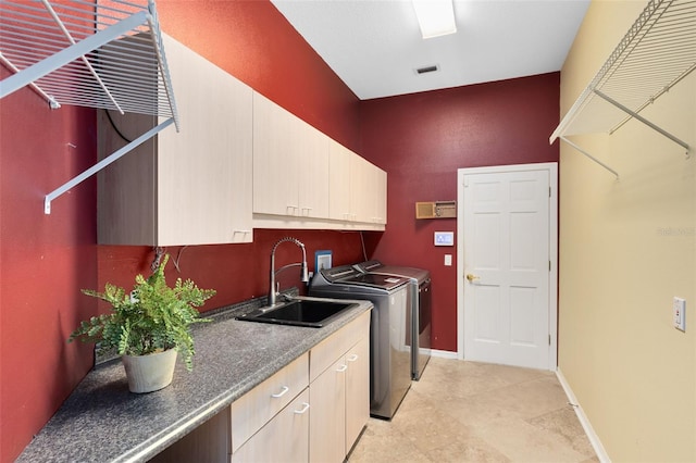 718 Glen Eagle Dr, Winter Springs, FL 32708 - laundry area featuring washer and clothes dryer, cabinet space, baseboards, light tile patterned flooring, and a towering ceiling