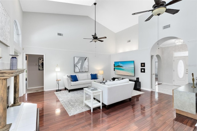 718 Glen Eagle Dr, Winter Springs, FL 32708 - living area with a ceiling fan, high vaulted ceiling, arched walkways, wood finished floors, and baseboards