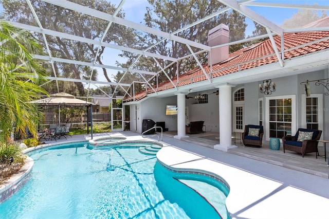 718 Glen Eagle Dr, Winter Springs, FL 32708 - view of pool featuring an in-ground hot tub, ceiling fan, a patio area, and a lanai