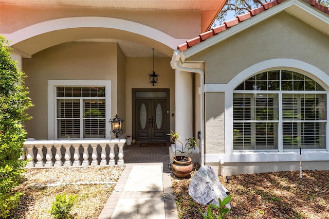 718 Glen Eagle Dr, Winter Springs, FL 32708 - property entrance featuring stucco siding and a porch