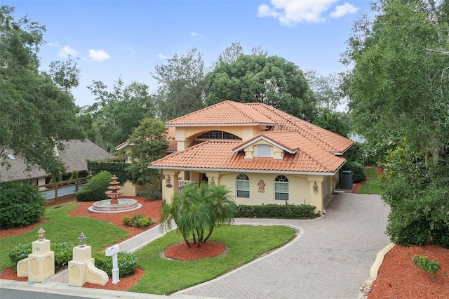 1542 Islay Ct, Apopka, FL 32712 - mediterranean / spanish-style house with decorative driveway, stucco siding, and a tile roof