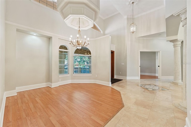 1542 Islay Ct, Apopka, FL 32712 - unfurnished dining area with a high ceiling, baseboards, and a chandelier