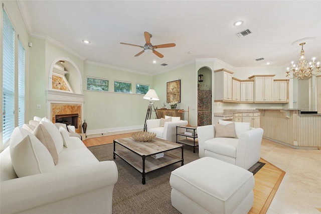 1542 Islay Ct, Apopka, FL 32712 - living area featuring ceiling fan, recessed lighting, a chandelier, crown molding, and a high end fireplace