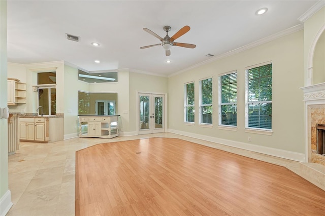 1542 Islay Ct, Apopka, FL 32712 - unfurnished living room with a fireplace, a sink, ceiling fan, recessed lighting, and french doors