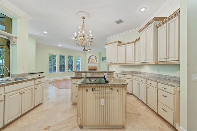 1542 Islay Ct, Apopka, FL 32712 - kitchen featuring cream cabinetry, a sink, a chandelier, crown molding, and recessed lighting