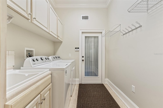 1542 Islay Ct, Apopka, FL 32712 - laundry area with washing machine and dryer, cabinet space, light tile patterned floors, ornamental molding, and baseboards