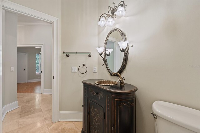 1542 Islay Ct, Apopka, FL 32712 - bathroom with toilet, vanity, baseboards, tile patterned floors, and ornamental molding
