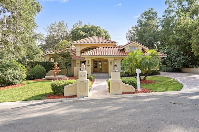 1542 Islay Ct, Apopka, FL 32712 - mediterranean / spanish home with a tile roof and stucco siding
