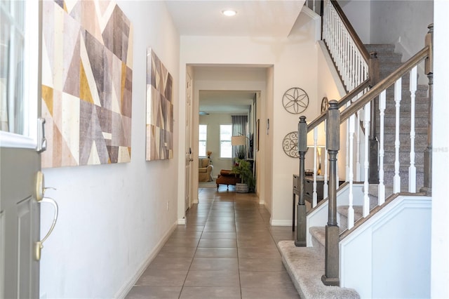 1505 Nassau Point Trl, Kissimmee, FL 34747 - tiled foyer entrance featuring stairs and baseboards